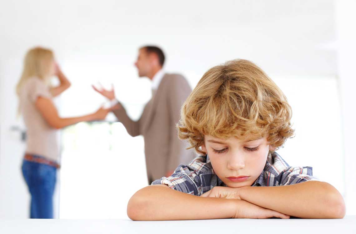 unhappy child because of arguement between parents